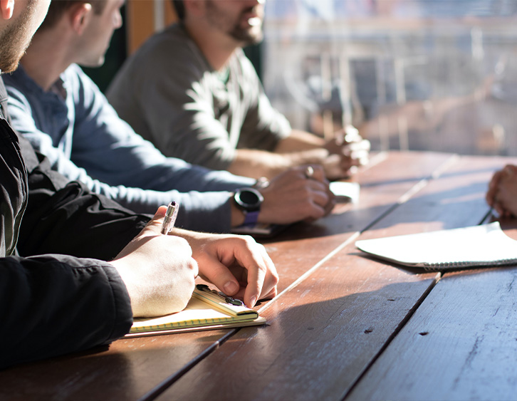 professionals meeting in an office with recruiting professionals